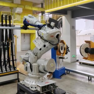 ABB robot holding automotive roof rails for cloth-wheel buffing
