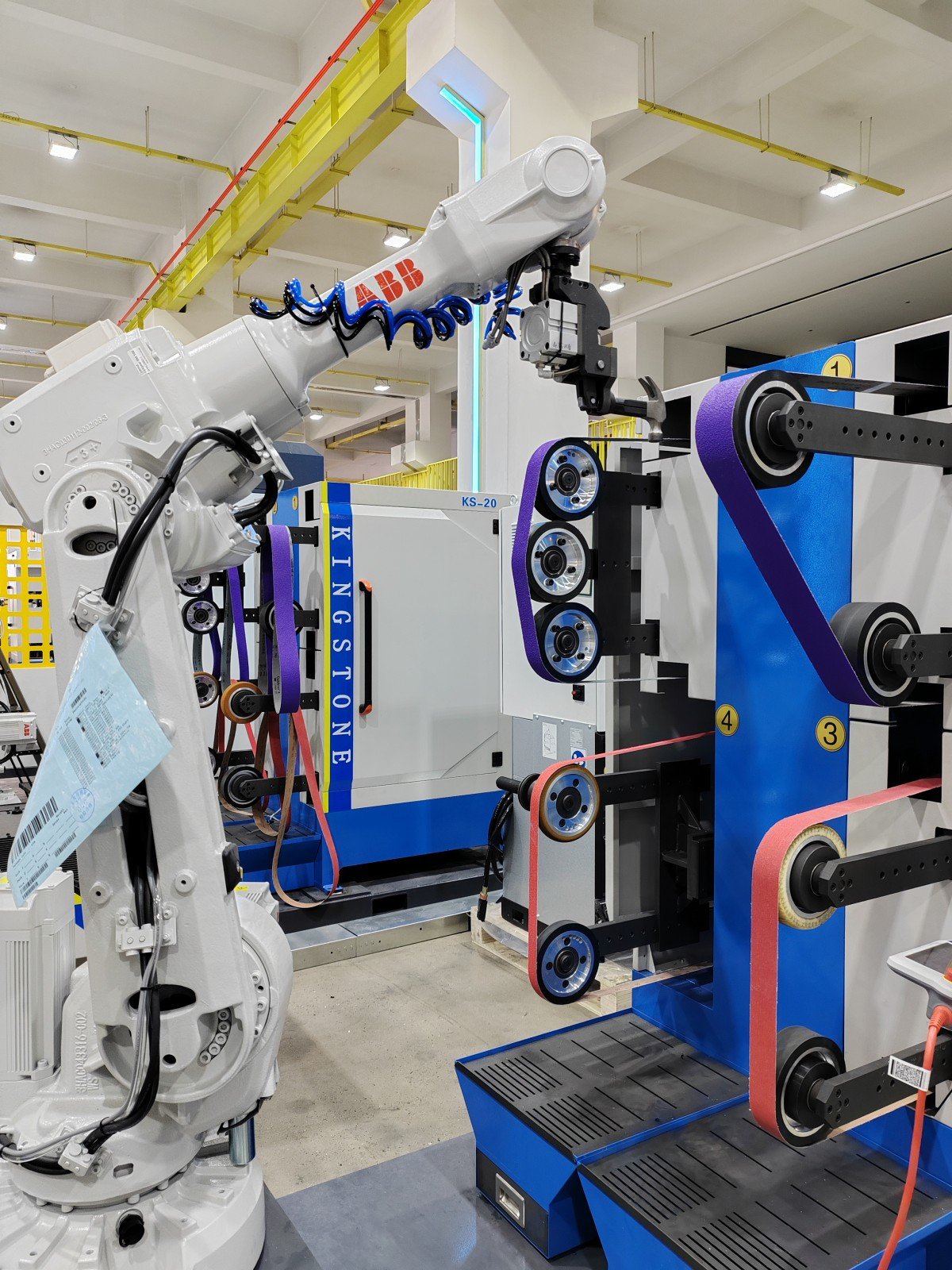 Four-Belt Robotic Grinding Cell
