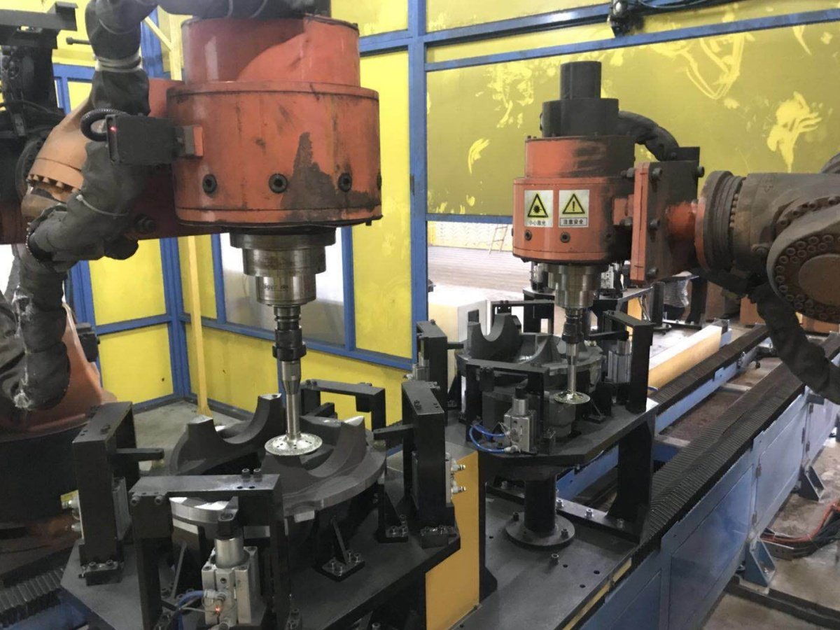 Robot-held tool grinding layouts