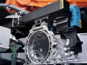 Robotic grinding and deburring system for a gearbox housing