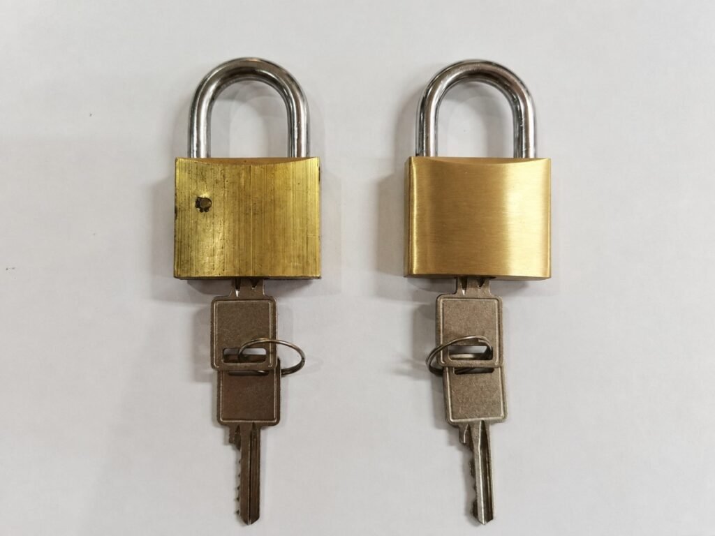 Before and after robotic polishing of brass padlock