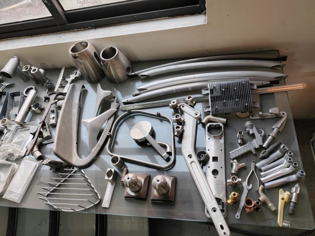 Different metal parts prepared for robotic grinding process evaluation
