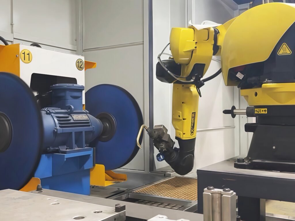 Robotic polishing fixture positioning a workpiece at the abrasive station