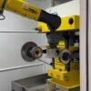 Robotic polishing cell processing a metal component
