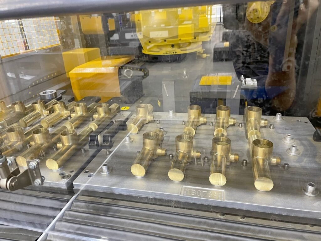 Polished metal parts arranged for visual surface comparison