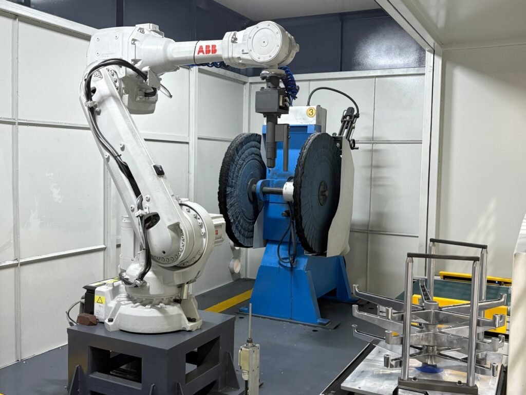 Buffing wheel station used for the final brightening of a metal part