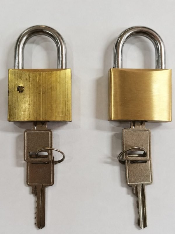 Before and after robotic polishing of brass padlock